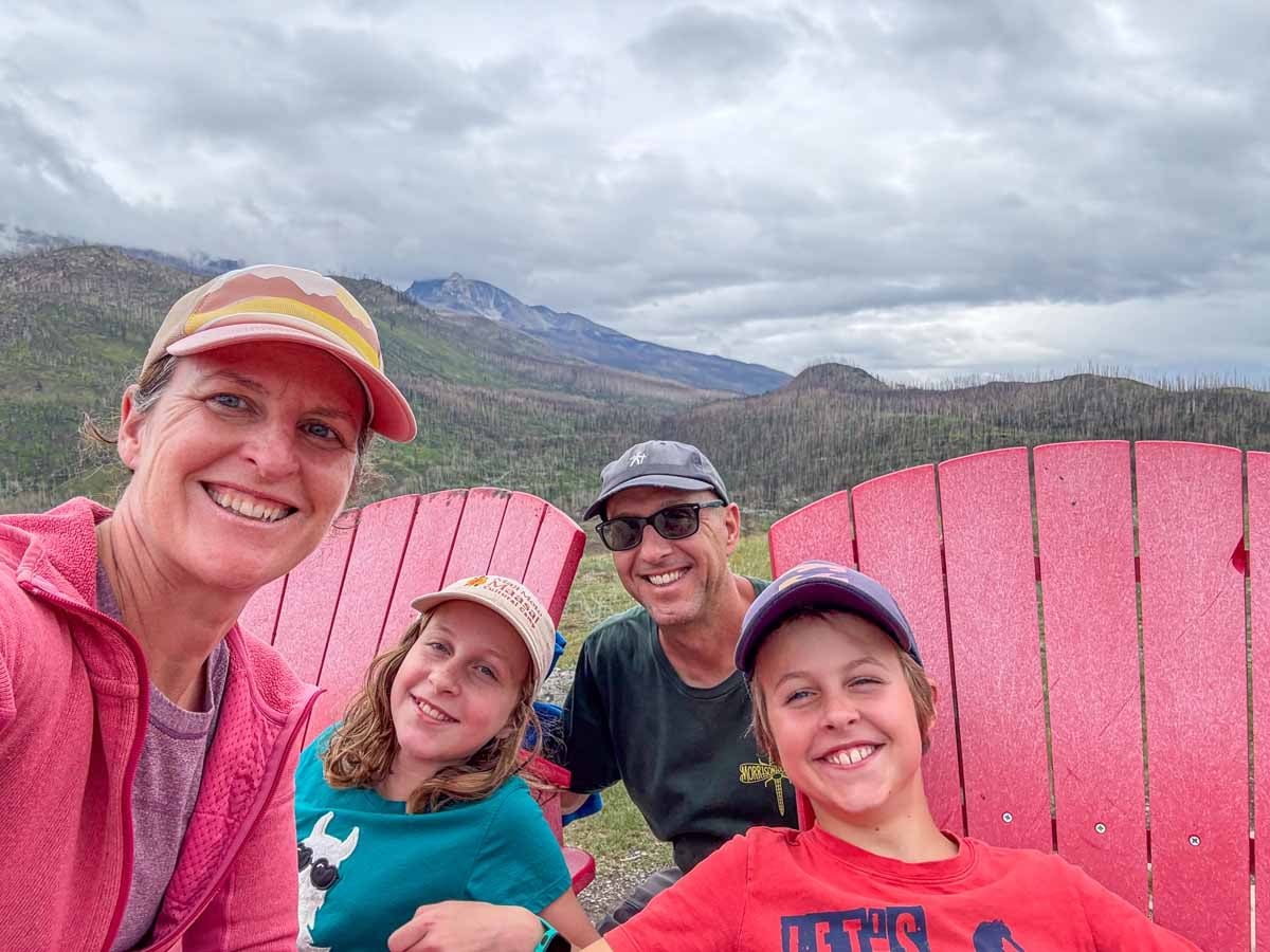 The Brewer family, from the TravelBanffCanada.com blog, has fun with the Parks Canada red chairs on the Old Fort Point hiking trail.